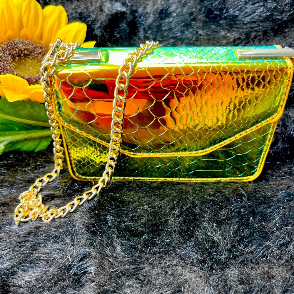 Unused metallic gold 3x4 mini single handed clutch.